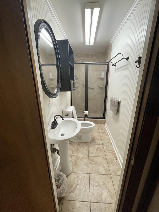 full bathroom with baseboards, toilet, and a stall shower