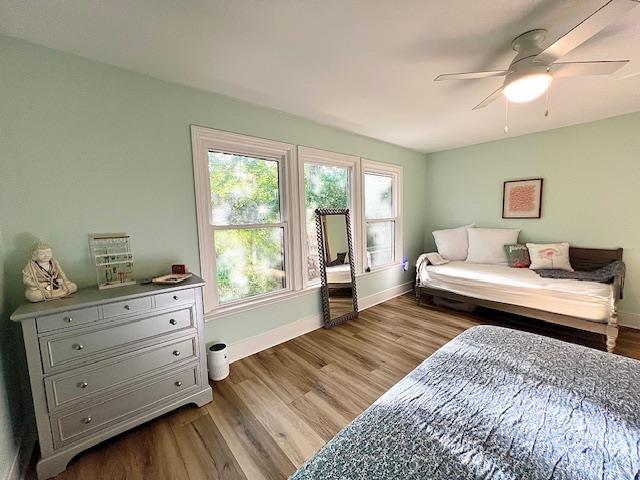 1814 Atlantis Pl, Tallahassee, FL 32303 - bedroom with baseboards, wood finished floors, and a ceiling fan