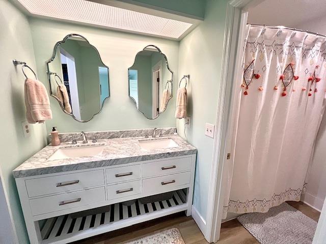 1814 Atlantis Pl, Tallahassee, FL 32303 - bathroom with wood finished floors and double vanity