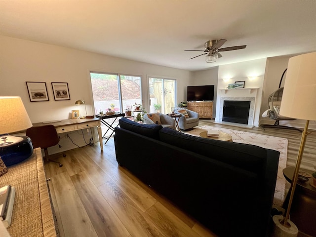 1814 Atlantis Pl, Tallahassee, FL 32303 - living room with a ceiling fan, light wood-type flooring, and a premium fireplace