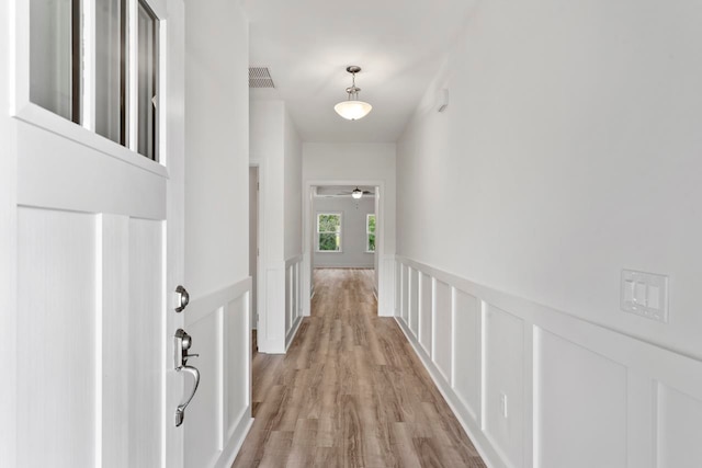 corridor featuring light hardwood / wood-style flooring