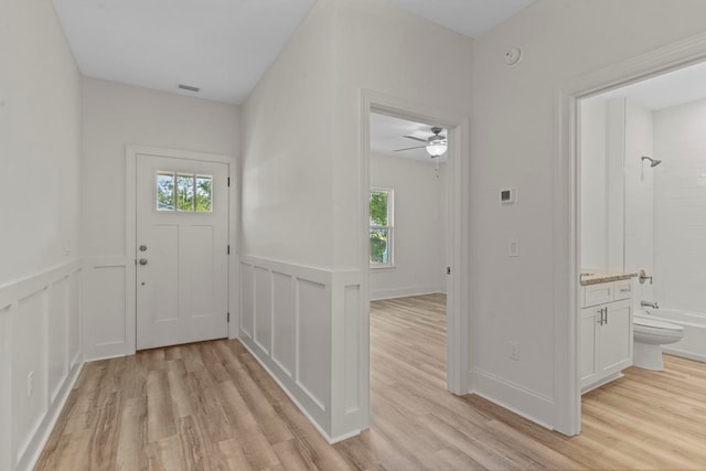 entryway featuring light hardwood / wood-style floors and ceiling fan