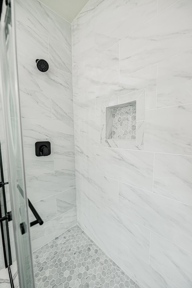 full bathroom with tiled shower