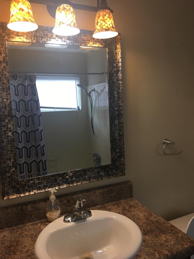 full bathroom with a shower and a sink