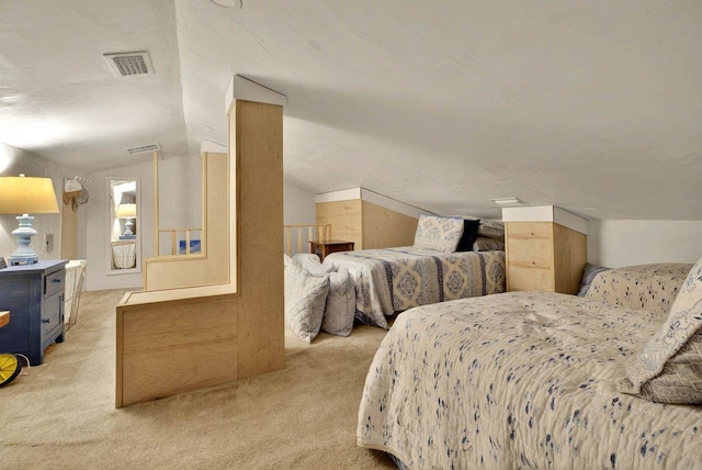 bedroom with light carpet and lofted ceiling