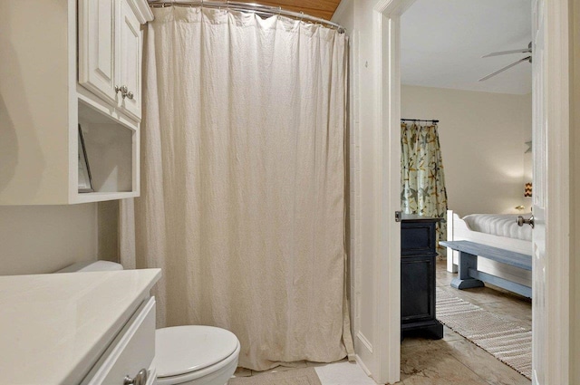bathroom featuring toilet and a ceiling fan