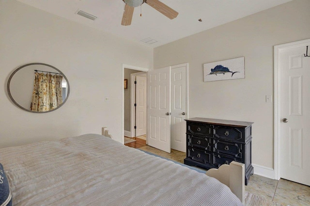 bedroom featuring a ceiling fan and baseboards