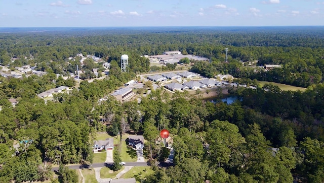 aerial view with a wooded view