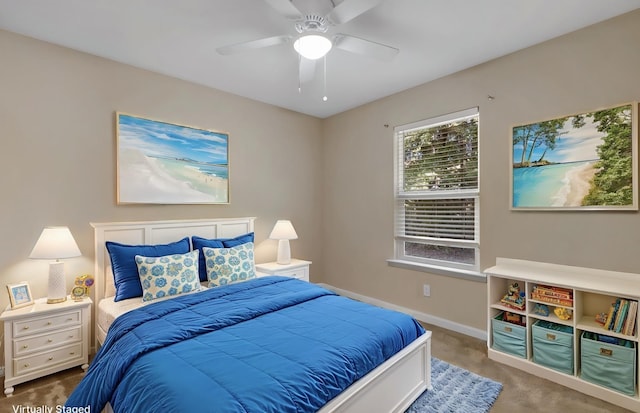 carpeted bedroom with baseboards and a ceiling fan