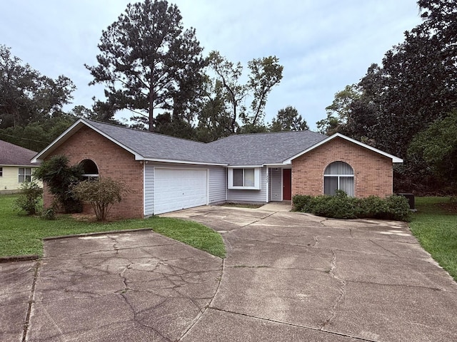 ranch-style house with brick siding, a front lawn, concrete driveway, roof with shingles, and an attached garage