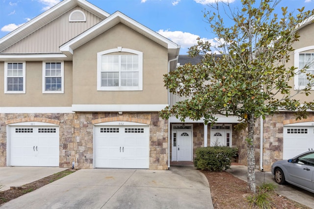 multi unit property featuring a garage