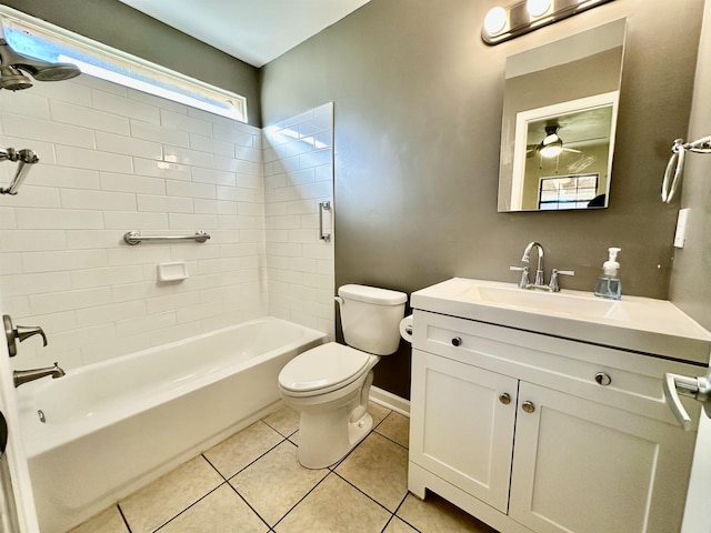 full bathroom with vanity, ceiling fan, tile patterned flooring, toilet, and tiled shower / bath