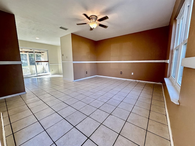 unfurnished room featuring ceiling fan and light tile patterned floors