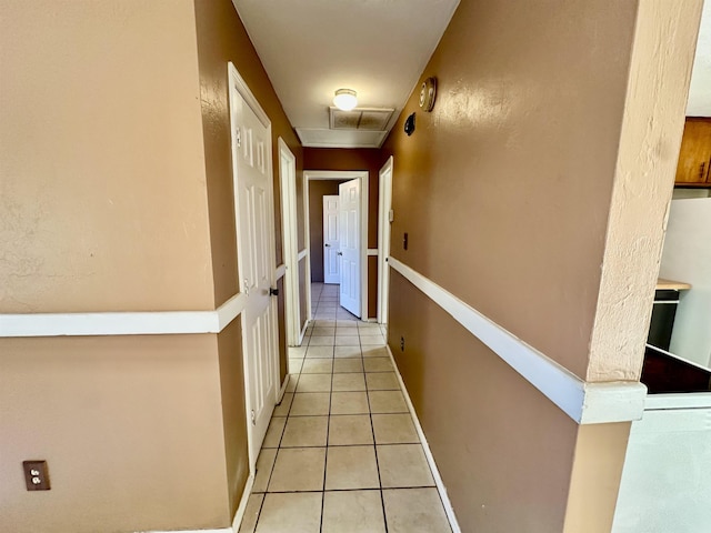 hall with light tile patterned flooring