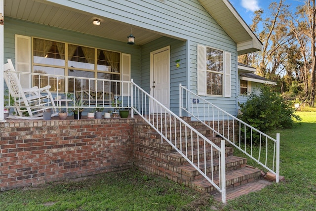 doorway to property with a yard