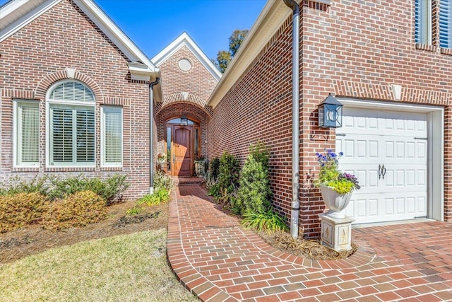 view of exterior entry featuring a garage