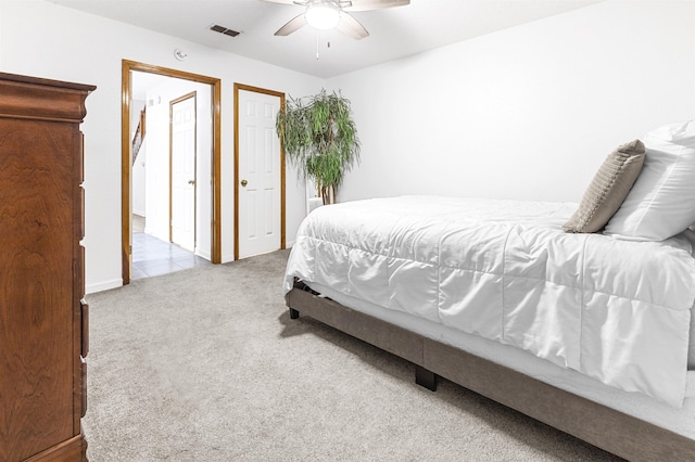 carpeted bedroom featuring ceiling fan