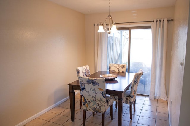 dining room featuring light tile patterned floors and a notable chandelier