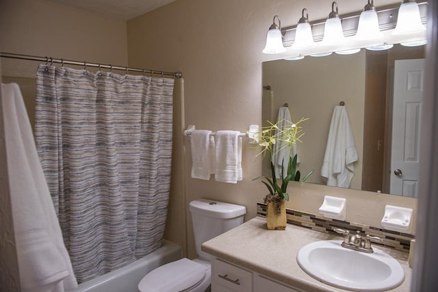 full bathroom featuring shower / bath combination with curtain, vanity, and toilet