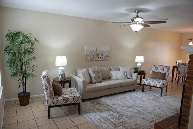 living room featuring light tile patterned flooring and ceiling fan