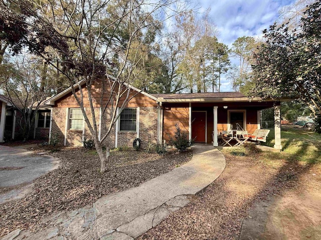 ranch-style house with brick siding