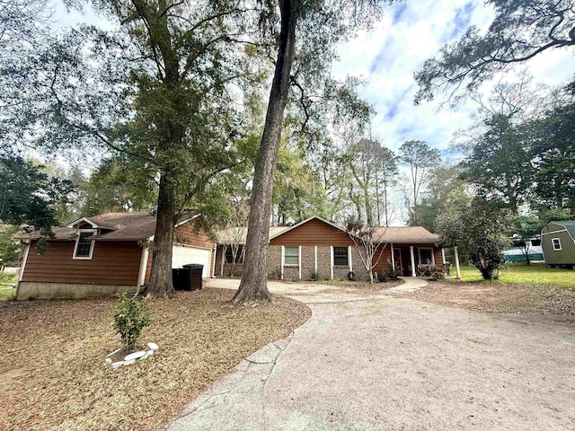 single story home with a garage and driveway