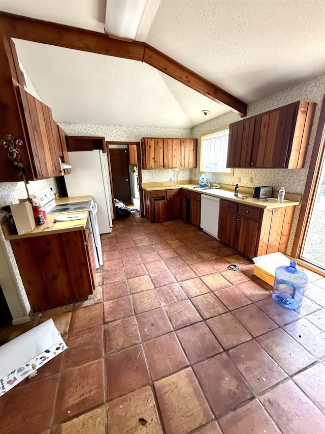 kitchen with lofted ceiling with beams, a textured ceiling, white appliances, light countertops, and tasteful backsplash