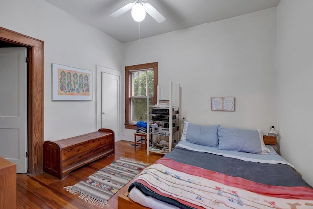 bedroom with ceiling fan and dark hardwood / wood-style floors