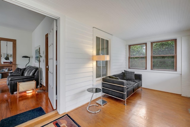 sitting room with wood-type flooring