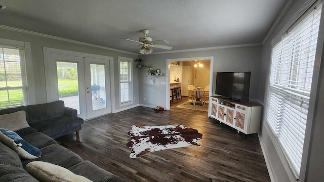 living room featuring visible vents, crown molding, ceiling fan, french doors, and wood finished floors