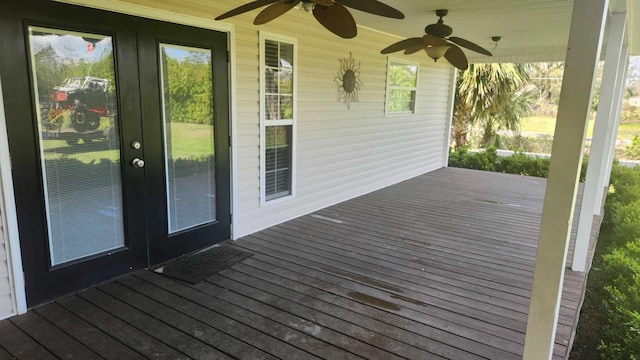 wooden deck featuring french doors and a ceiling fan