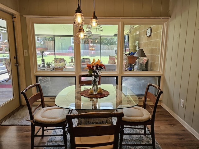 819 Abbiegail Dr, Tallahassee, FL 32303 - dining room with wood finished floors, wooden walls, and baseboards