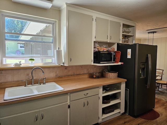 819 Abbiegail Dr, Tallahassee, FL 32303 - kitchen featuring refrigerator with ice dispenser, a sink, open shelves, tasteful backsplash, and dark wood-style floors