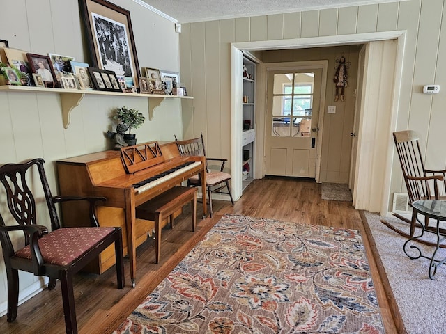 819 Abbiegail Dr, Tallahassee, FL 32303 - sitting room with ornamental molding, wood finished floors, and a decorative wall