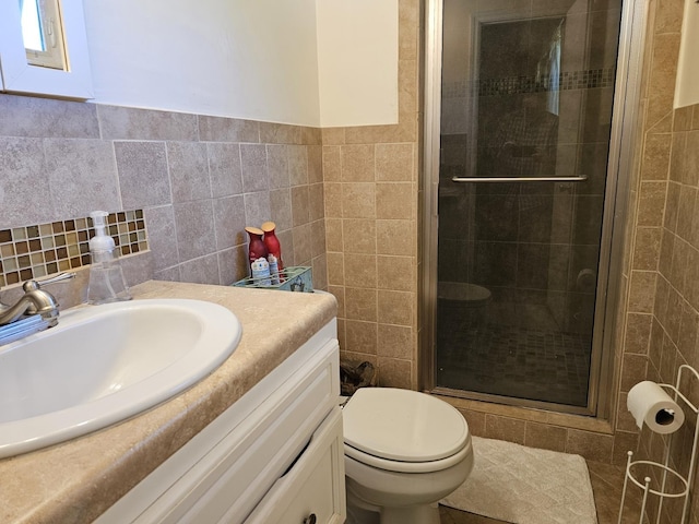 819 Abbiegail Dr, Tallahassee, FL 32303 - bathroom featuring tile walls, vanity, a shower stall, and toilet