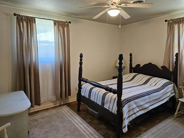 819 Abbiegail Dr, Tallahassee, FL 32303 - bedroom with multiple windows, a ceiling fan, and baseboards