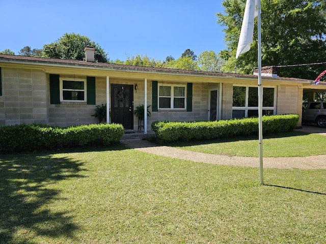 819 Abbiegail Dr, Tallahassee, FL 32303 - ranch-style house featuring a chimney, concrete block siding, and a front lawn