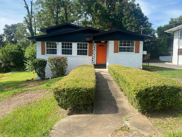 bungalow with a front lawn