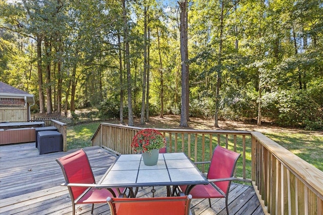 deck featuring a hot tub