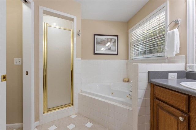 bathroom with vanity, tile patterned floors, and separate shower and tub