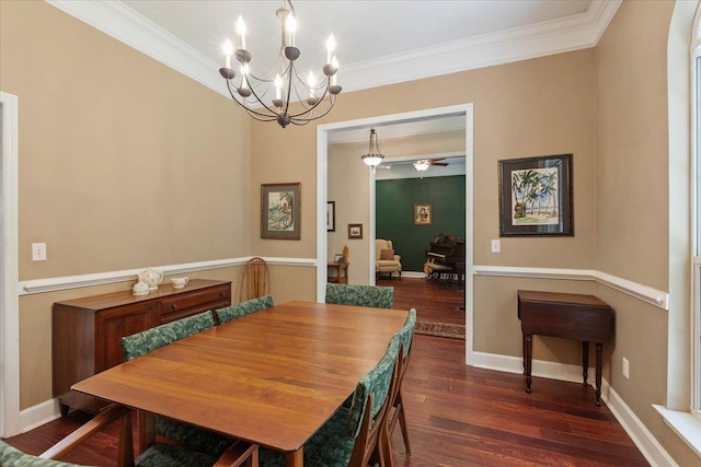 dining room with dark hardwood / wood-style flooring, a chandelier, and crown molding