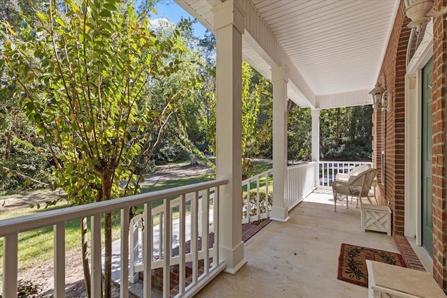 balcony featuring a porch