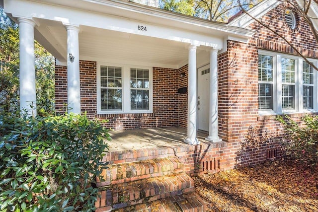 entrance to property featuring covered porch