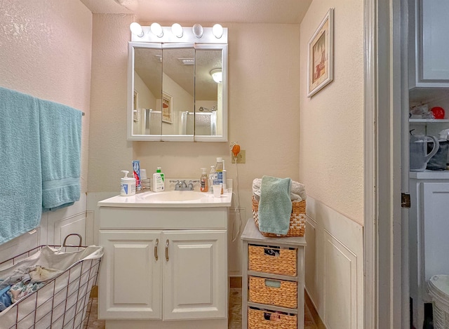 bathroom with vanity and a textured ceiling