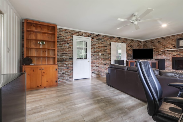 1917 Sharon Rd, Tallahassee, FL 32303 - living area with ceiling fan, light wood-style floors, and brick wall