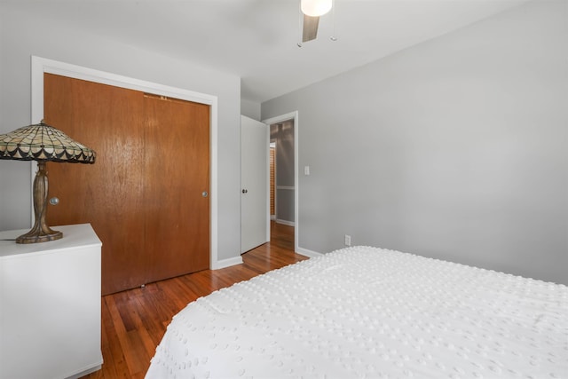 1917 Sharon Rd, Tallahassee, FL 32303 - bedroom featuring a closet, wood finished floors, a ceiling fan, and baseboards