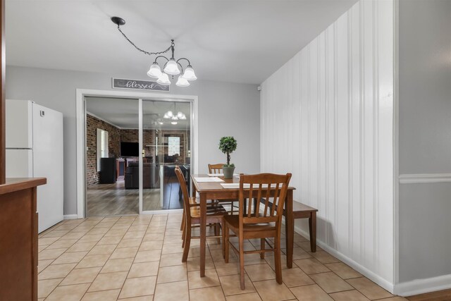 1917 Sharon Rd, Tallahassee, FL 32303 - dining room featuring a chandelier, light tile patterned floors, and baseboards