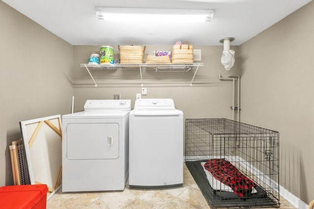 washroom featuring independent washer and dryer