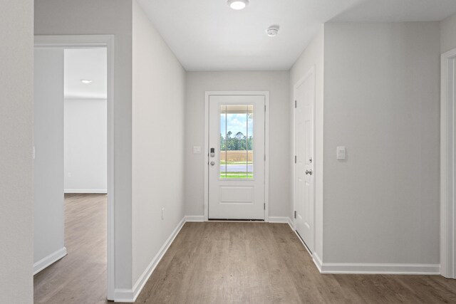 doorway to outside with light hardwood / wood-style floors