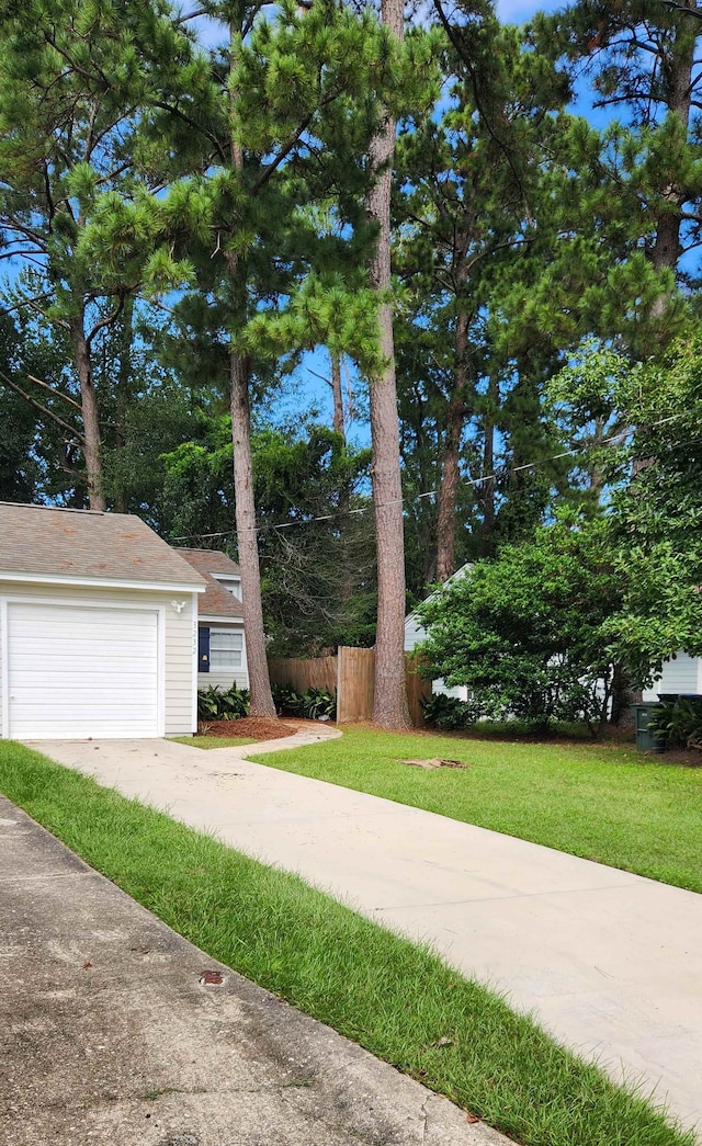 view of front of property with a garage and a front yard